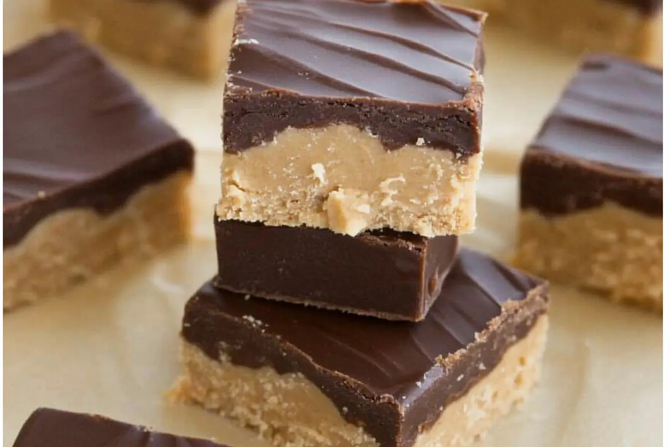 Assorted homemade peanut butter candies on a wooden table